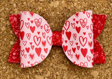 Load image into Gallery viewer, Red Doodle Hearts Glitter Leatherette Bow
