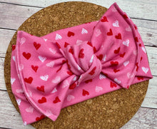 Load image into Gallery viewer, Pink Mini Hearts Knit Infant Knotted Bow Headwrap

