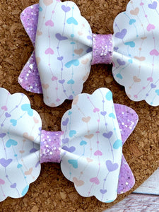 Pastel Heart Strings Pinch Layered Leatherette Piggies Bow