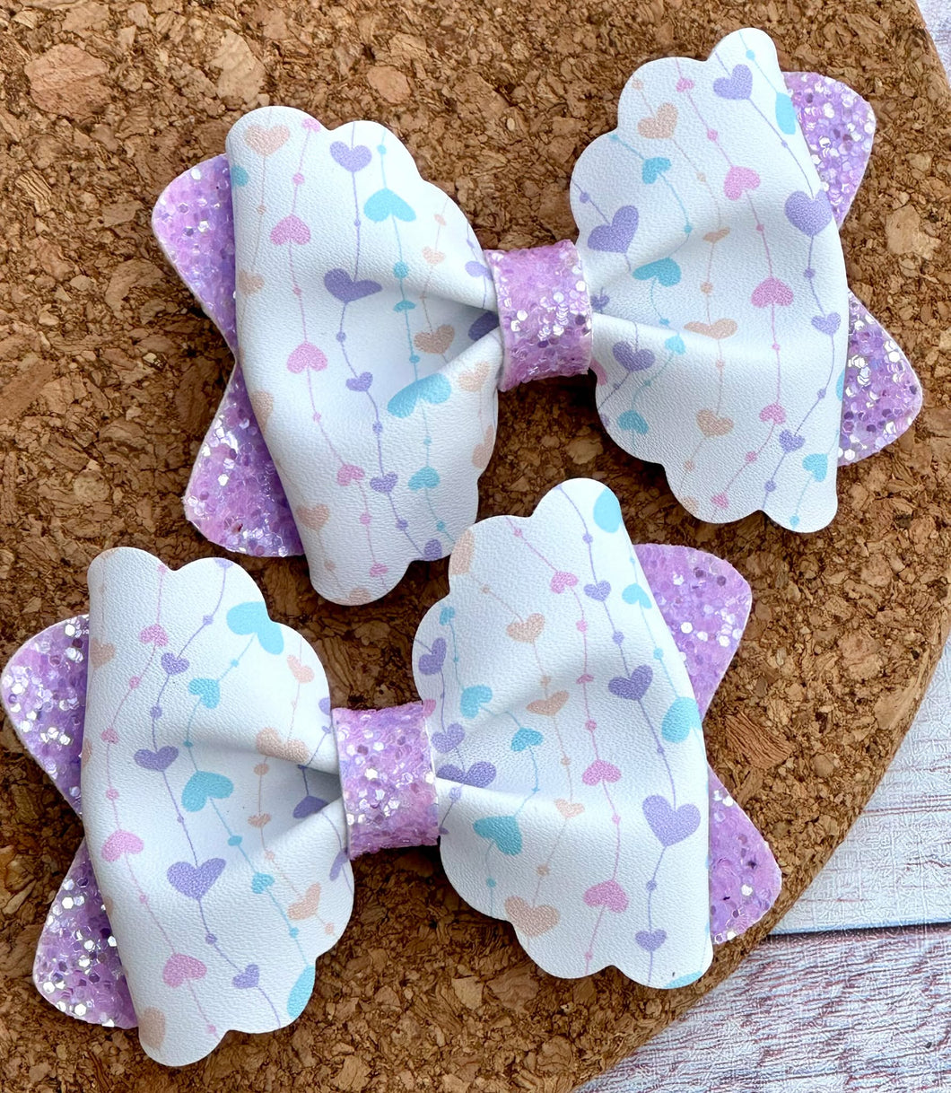 Pastel Heart Strings Pinch Layered Leatherette Piggies Bow