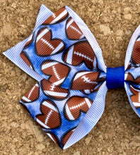 Load image into Gallery viewer, Footballs On Blue Pattern Bow
