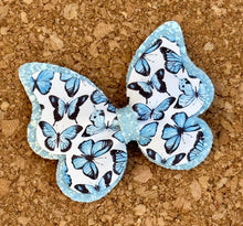 Load image into Gallery viewer, Blue Butterfly Glitter Layered Leatherette Bow
